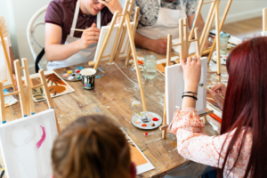 Participant painting during a creative workshop session